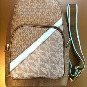 Original, New Michael Kors sling backpack for women and men.
